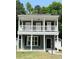 Charming two-story home with a classic design, complemented by a well-maintained lawn and surrounded by lush greenery at 4818 Buttercup Way, Summerville, SC 29485