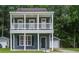 Charming two-story home with double porches, complemented by a well-maintained yard and inviting curb appeal at 4818 Buttercup Way, Summerville, SC 29485
