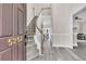 Elegant foyer with hardwood floors and a staircase leading to the upper level, showcasing a bright and open layout at 5257 Mulholland Dr, Summerville, SC 29485