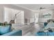 Inviting foyer featuring staircase, living room access and gray floors at 5257 Mulholland Dr, Summerville, SC 29485