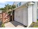 Detached white garage with double doors, offering ample storage and parking space, located beside the house at 5257 Mulholland Dr, Summerville, SC 29485