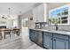 Bright kitchen featuring updated appliances, a breakfast nook, and views into the adjoining dining and living areas at 5257 Mulholland Dr, Summerville, SC 29485