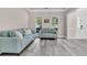 Cozy living room with stylish sofas, gray floors, and plenty of natural light at 5257 Mulholland Dr, Summerville, SC 29485