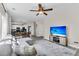 Relaxing living room featuring a plush gray sectional, ceiling fan, and mounted TV at 5257 Mulholland Dr, Summerville, SC 29485