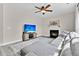 Comfortable living room with a fireplace, TV, ceiling fan and a plush gray sectional sofa at 5257 Mulholland Dr, Summerville, SC 29485