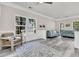 Charming living room filled with natural light, comfortable seating, and a decorative rug at 5257 Mulholland Dr, Summerville, SC 29485