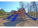Community wooden playground with slides and swings for Gathering fun at 5257 Mulholland Dr, Summerville, SC 29485