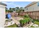 Fenced yard with garden beds, a bin, and a bicycle at 5257 Mulholland Dr, Summerville, SC 29485
