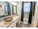 Bright bathroom featuring a unique bowl sink, granite countertop, and stylish tile flooring at 529 Laurel Ridge Rd, North Charleston, SC 29418