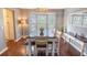 Dining room showcases a sleek table, stylish chairs, a modern chandelier, and a large bay window at 529 Laurel Ridge Rd, North Charleston, SC 29418