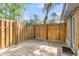 Wooden back deck with wooden privacy fence and view of backyard trees at 5375 Highway 174, Adams Run, SC 29426
