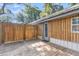 Inviting deck with wooden fence providing privacy, perfect for outdoor relaxation and entertaining at 5375 Highway 174, Adams Run, SC 29426