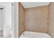 Bathroom showcasing tan tiled shower and tub with tiled floors at 5375 Highway 174, Adams Run, SC 29426