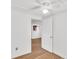 Bedroom showcasing natural light, wood floors and white walls with open door at 5375 Highway 174, Adams Run, SC 29426