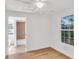 Bedroom with neutral walls, ceiling fan, and an en suite bathroom at 5375 Highway 174, Adams Run, SC 29426