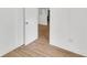 Bright bedroom showcasing wood floors and white walls with open door at 5375 Highway 174, Adams Run, SC 29426