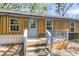 Charming home featuring wood siding, a metal roof, and a welcoming entryway with light blue trim at 5375 Highway 174, Adams Run, SC 29426