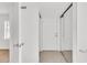 Hallway featuring a sliding closet door and light-colored tiled floors at 5375 Highway 174, Adams Run, SC 29426