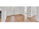 Bright, airy living room featuring light wood floors and crisp white walls, ready for personal touches at 5375 Highway 174, Adams Run, SC 29426