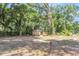 Home nestled among mature trees and lush greenery, offering a serene and private setting at 5375 Highway 174, Adams Run, SC 29426