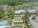 Aerial view showcases the community pool, clubhouse, bocce ball court, and surrounding lush greenery at 546 Sea Foam St, Summerville, SC 29486