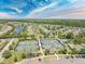 Beautiful aerial view of the community featuring tennis courts, a playground, and well-maintained landscaping at 546 Sea Foam St, Summerville, SC 29486