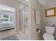 Clean bathroom featuring a glass-enclosed shower, toilet, vanity, and view to the main bedroom at 546 Sea Foam St, Summerville, SC 29486