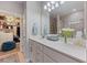 Bright bathroom featuring a glass-enclosed shower, walk-in closet, and well-lit vanity with fresh towels at 546 Sea Foam St, Summerville, SC 29486