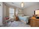 Cozy bedroom with a window view, soft blue bedding, and classic furnishings creating a relaxing retreat at 546 Sea Foam St, Summerville, SC 29486