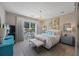 Bright bedroom with view of water, light walls, neutral decor, complemented with a decorative chandelier at 546 Sea Foam St, Summerville, SC 29486