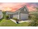 Charming home featuring a two-car garage with well-maintained landscaping at 546 Sea Foam St, Summerville, SC 29486