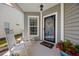Inviting front porch featuring rocking chairs, and a welcoming front door with a wreath at 546 Sea Foam St, Summerville, SC 29486