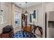 Inviting home office with natural light, classic desk, blue patterned rug, and built-in shelving at 546 Sea Foam St, Summerville, SC 29486