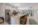 Spacious kitchen with white cabinets, stainless appliances, granite countertops, and a large island at 546 Sea Foam St, Summerville, SC 29486