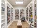 Charming library with floor to ceiling bookshelves filled with a variety of books and reading nooks at 546 Sea Foam St, Summerville, SC 29486
