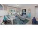 Bright living room featuring lots of light, stylish decor, and a view of the yard at 546 Sea Foam St, Summerville, SC 29486