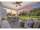 Comfortable screened porch with plush seating and a scenic pond view at 546 Sea Foam St, Summerville, SC 29486