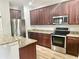 Kitchen featuring stainless steel appliances, granite countertops, and wood cabinets at 610 Knowledge Dr, Ladson, SC 29456