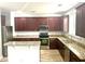 Kitchen boasts stainless steel appliances, granite countertops, and spacious island seating at 610 Knowledge Dr, Ladson, SC 29456