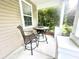 Cozy front porch with a small table and chairs, a perfect place to unwind and enjoy the outdoors at 610 Knowledge Dr, Ladson, SC 29456