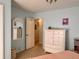 Bedroom with white painted dresser, mirror, and doorway to hall, offering plenty of storage and style at 7 Lavington Rd, Charleston, SC 29407