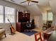 Bright bedroom featuring a built-in desk, an accent guitar, and a comfy chair at 7 Lavington Rd, Charleston, SC 29407