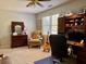This bedroom includes a cozy chair and built-in desk for a comfortable aesthetic at 7 Lavington Rd, Charleston, SC 29407