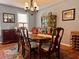 Traditional dining room showcases a wooden table, six chairs, a chandelier and a decorative cabinet at 7 Lavington Rd, Charleston, SC 29407