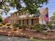 Charming two-story brick home with an American flag, manicured landscaping, and a welcoming front facade at 7 Lavington Rd, Charleston, SC 29407