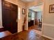 Inviting foyer featuring natural stone flooring, dark wood front door and an entry into the dining room at 7 Lavington Rd, Charleston, SC 29407