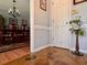 Foyer features a stone floor, a plant stand, and a partial view into a formal dining room at 7 Lavington Rd, Charleston, SC 29407