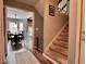 Cozy hallway leads to the staircase and dining room with natural light from large windows at 7 Lavington Rd, Charleston, SC 29407