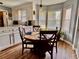 Bright kitchen with modern table set, large windows, and white cabinetry for ample storage at 7 Lavington Rd, Charleston, SC 29407