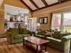 A spacious living area with access to an open kitchen, featuring comfortable sofas and natural light at 7 Lavington Rd, Charleston, SC 29407